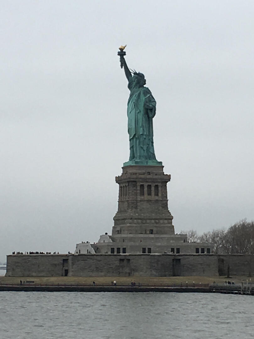 she stands in the harbor